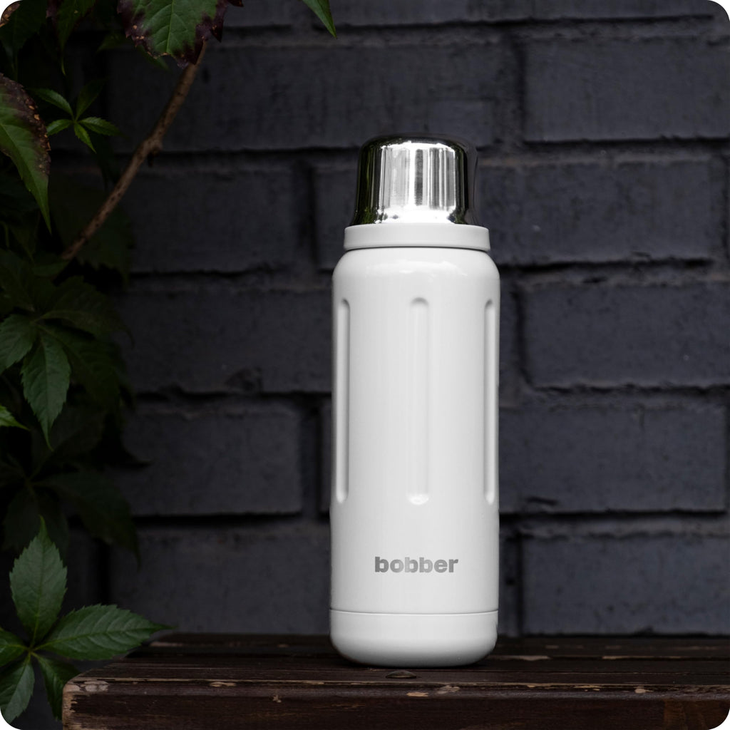 BOBBER 26 oz Stainless Steel Travel Thermo Bottle for Hot Drinks – Dishwasher Safe Metal Water Bottle with Cup Lid for Men, Hiking – Keeps Hot for 36 Hours – BPA-Free, Vacuum Insulated (Iced Water)