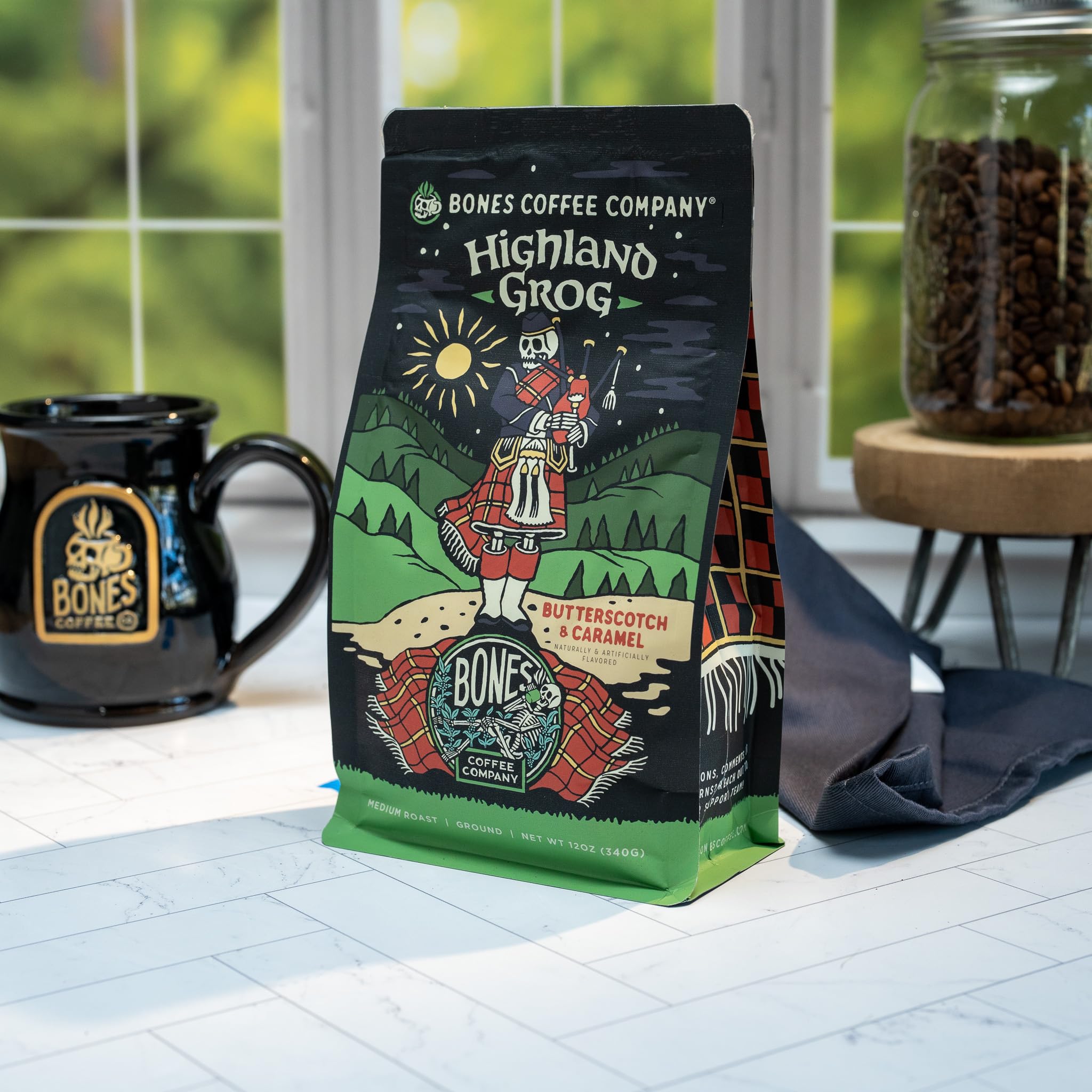 Bones Coffee Company Highland Grog, Butterscotch Caramel Flavored Coffee, Medium Roast Low Acid Arabica Beans Compatible with Auto drip and French Press Coffee Maker, 12 Oz Whole Bean